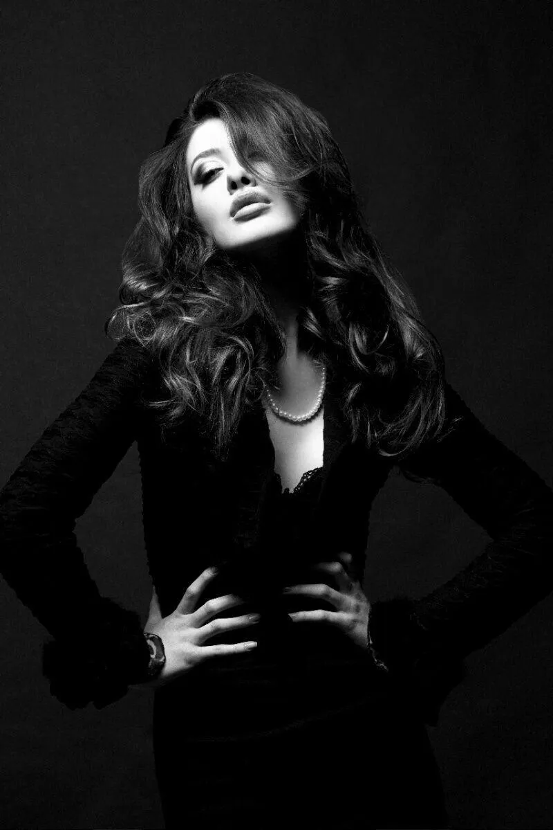 Confident Woman in a Black and White Dramatic Studio Photo