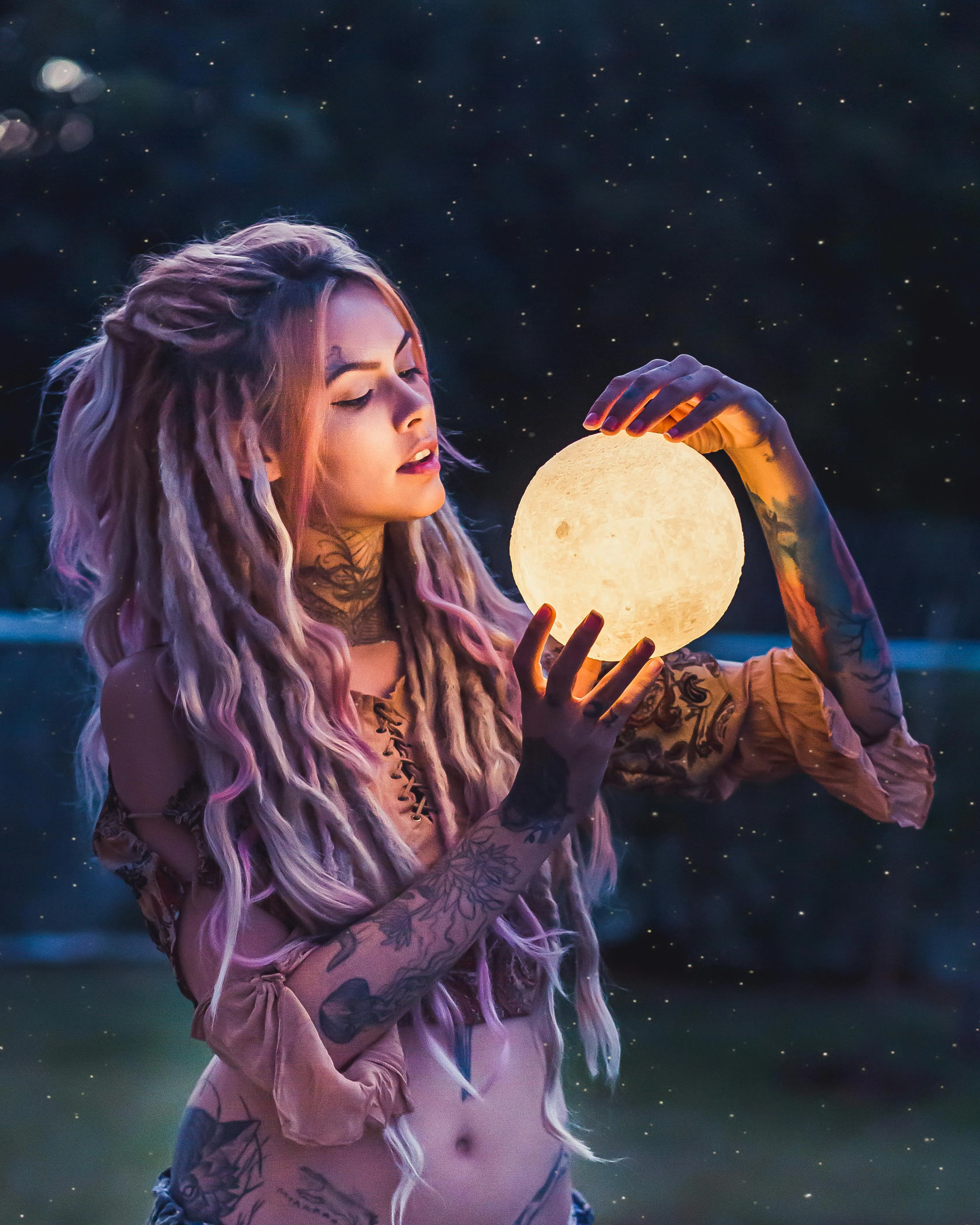 Creative Woman Holding Glowing Orb with a Night time Vibe