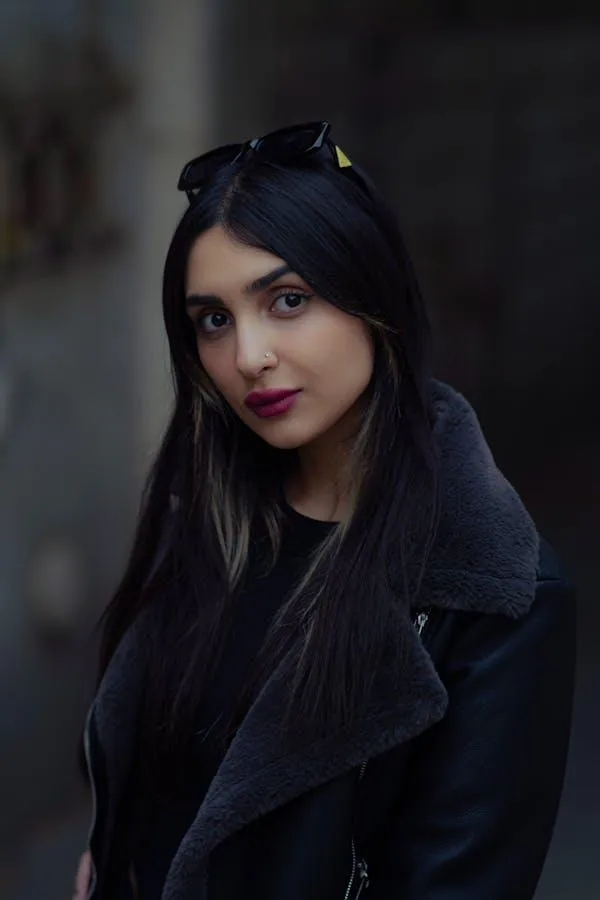 Cute Woman in Black Jacket Posing in a Dark Moody Setting