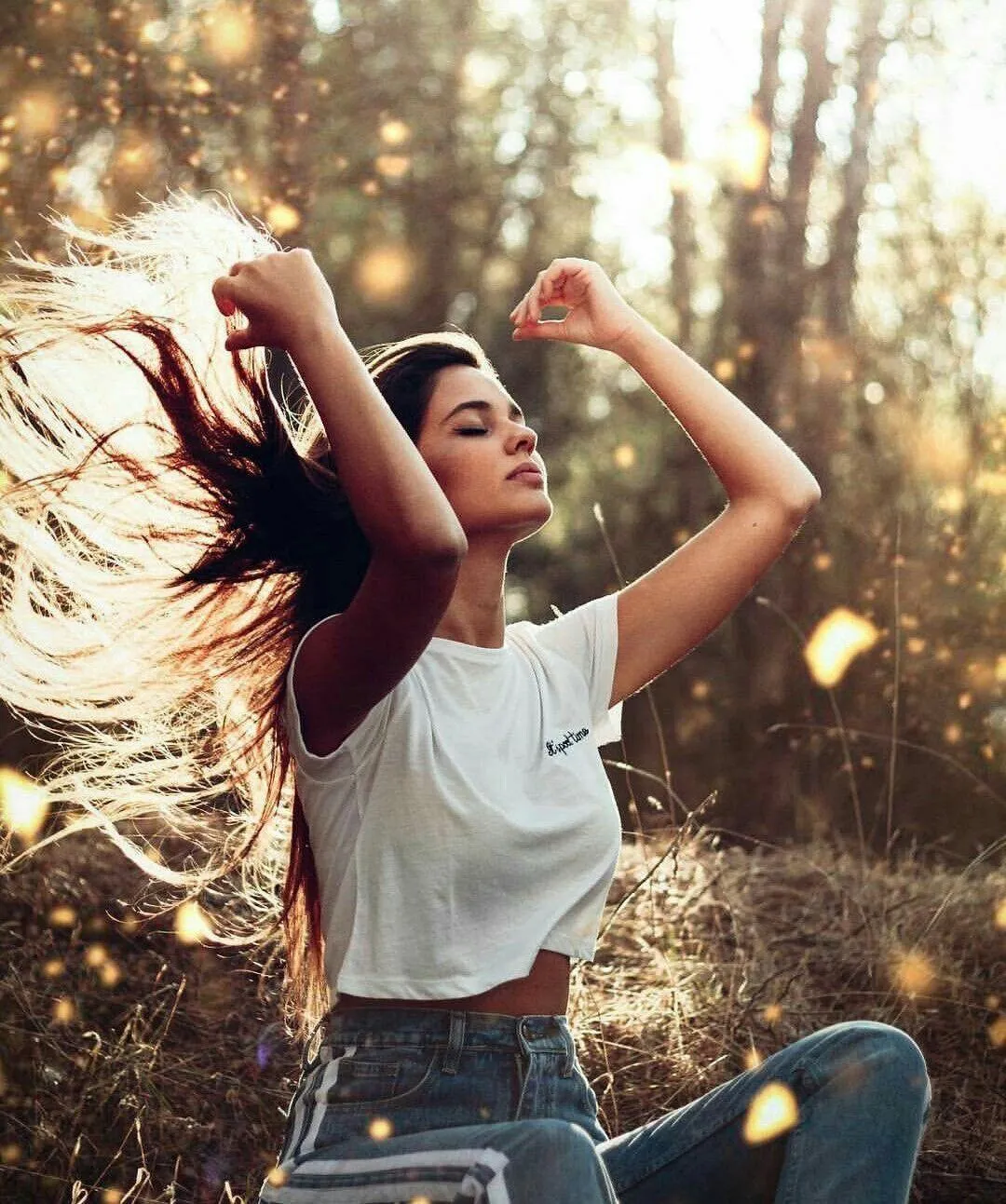 Cute Woman Lying in a Field of Daisies on a Sunny Afternoon