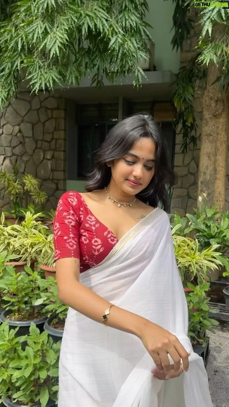 Devika Sanjay standing outdoors wearing a Neriyal saree