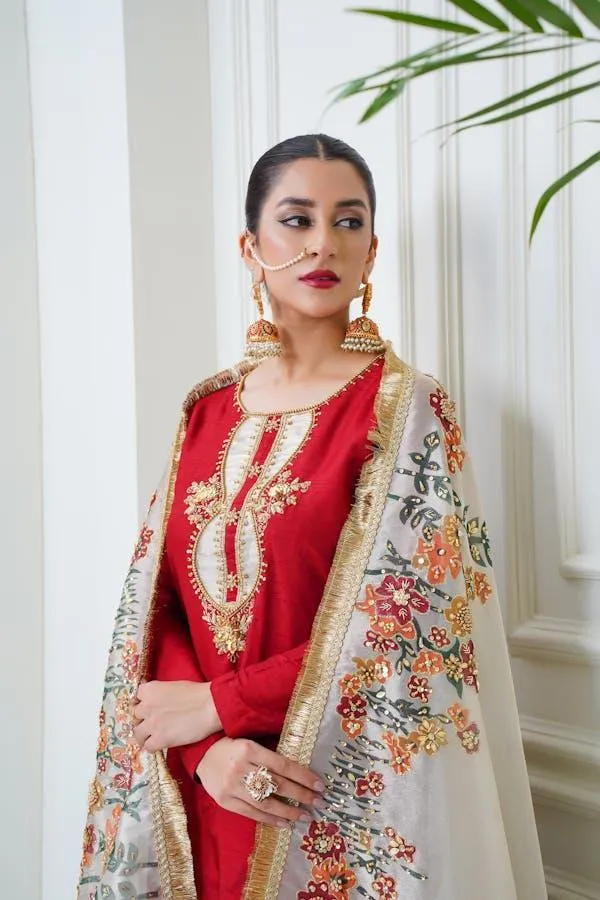 Elegant Woman Dressed in Red and Floral Traditional Attire