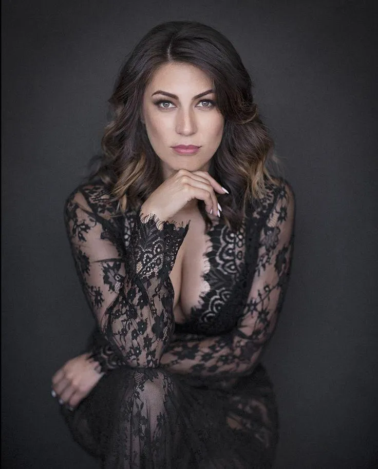 Elegant Woman in Lace Dress Posing Thoughtfully For Portrait
