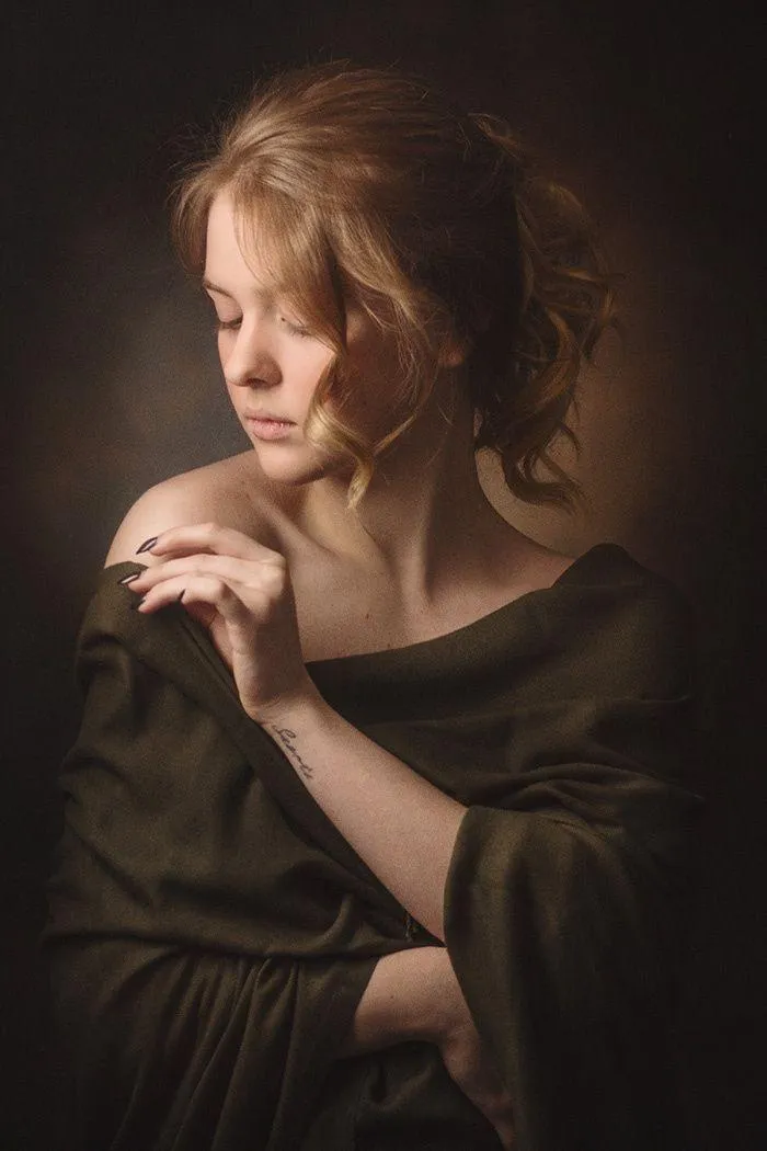 Elegant Woman in a Soft Light with a Vintage Style Pose