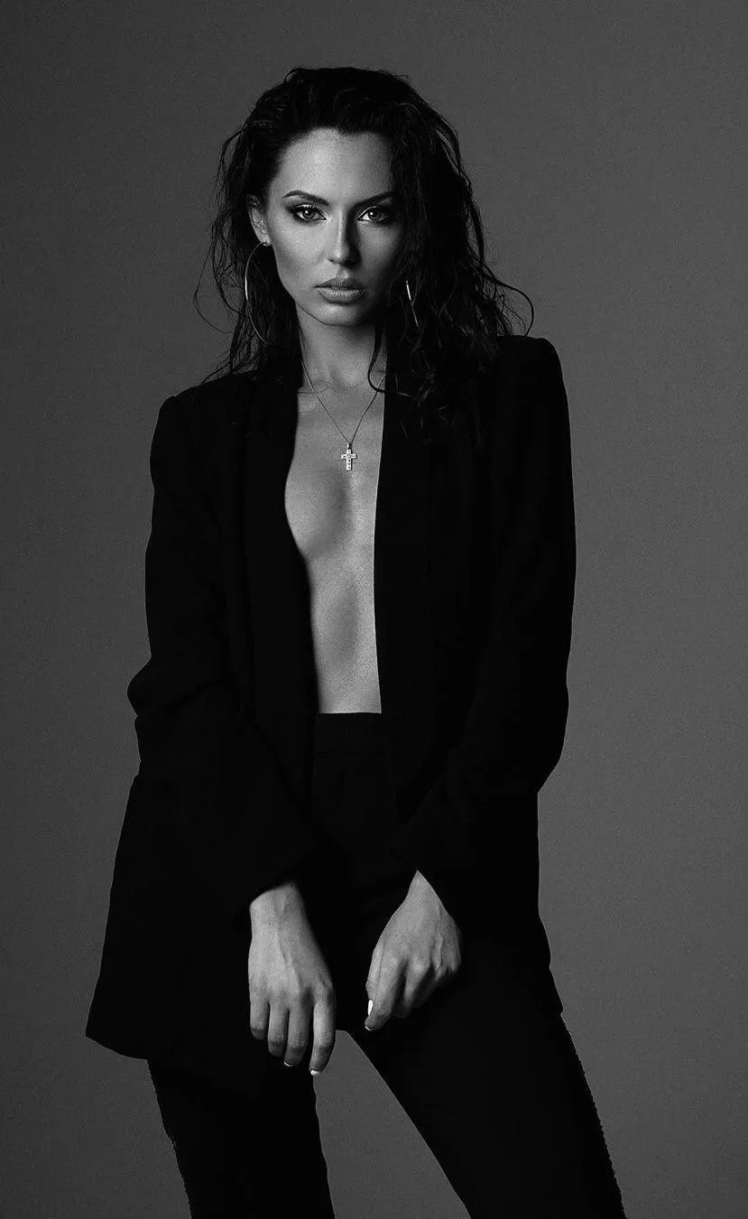 Fashion Model in a Black Jacket with an Intense Runway Look