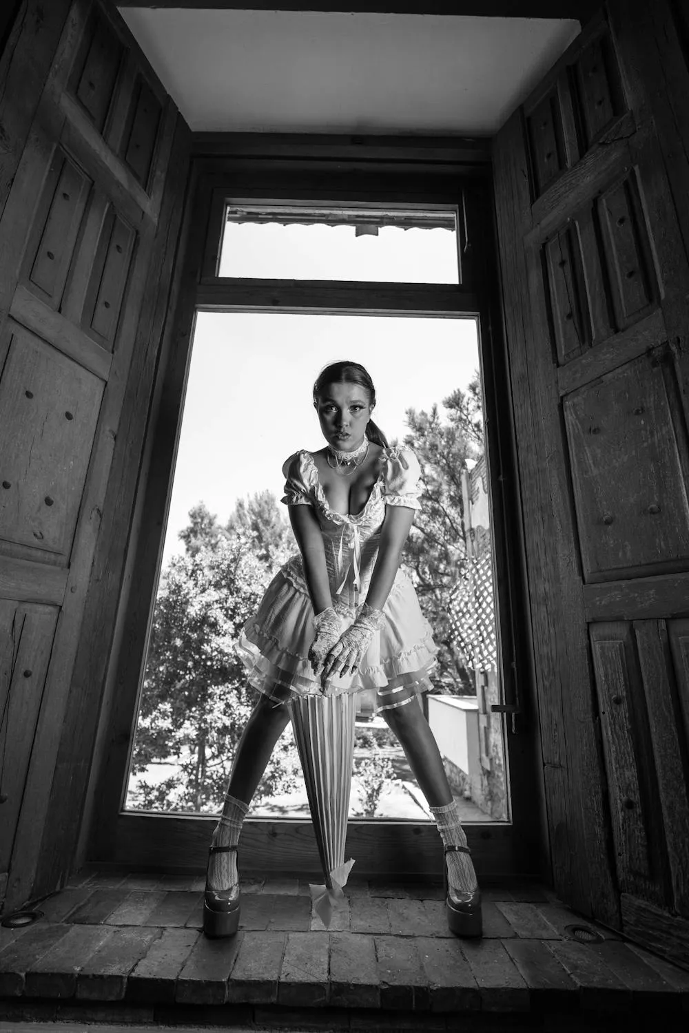 Fashion Model Posing in Doorway with Confidence Hd Wallpaper