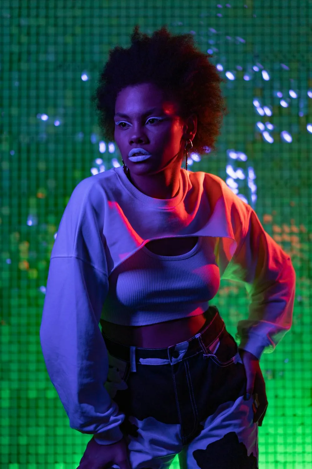 Fashionable Woman in Neon Lights with Green Background Image