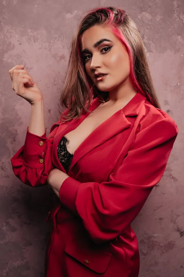 Female Model in a Red Blazer Posing Confidently Indoors