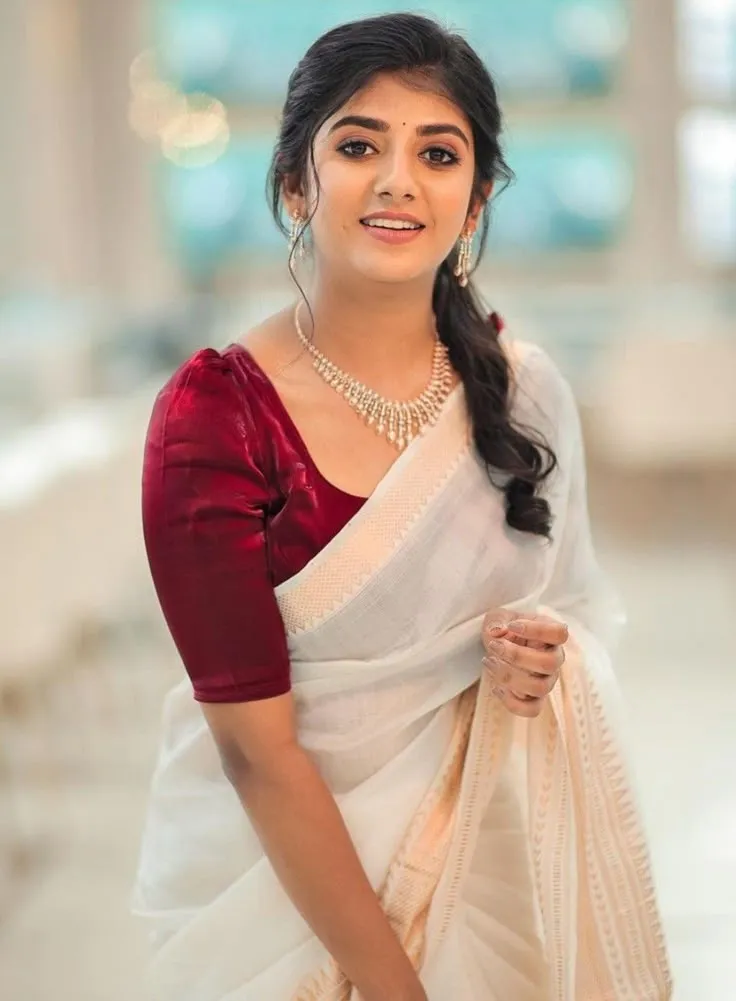 Gabriella Charlton in a white saree with a red blouse image