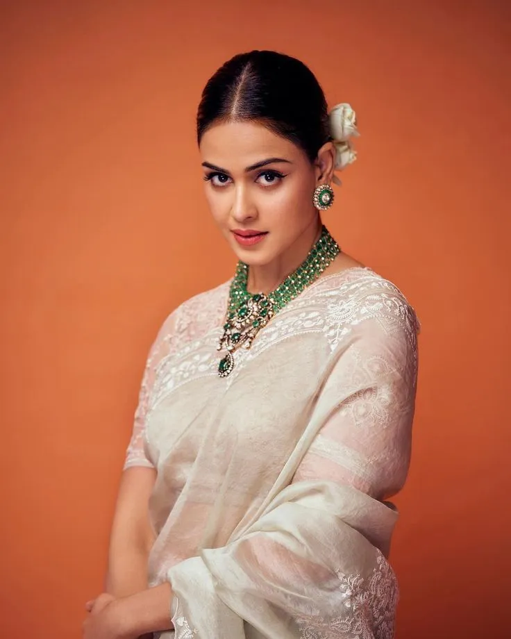 Genelia in a white Kerala saree in the studio setting image