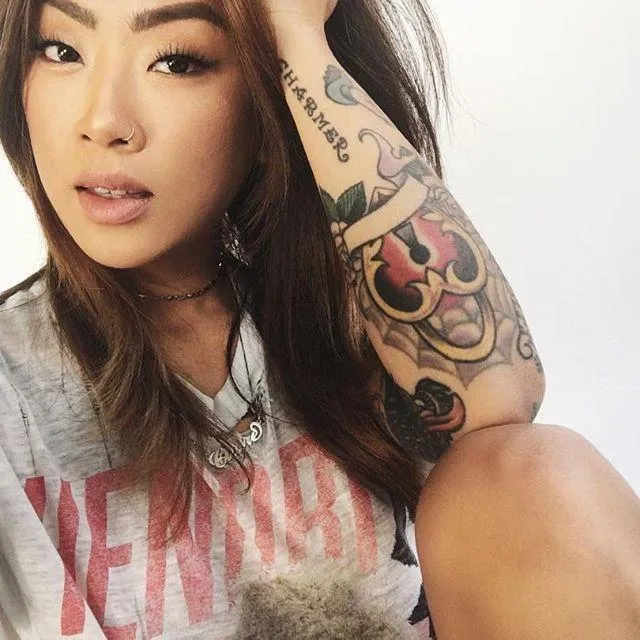 Girl with a Bicycle in a Golden Wheat Field At Sunset Image