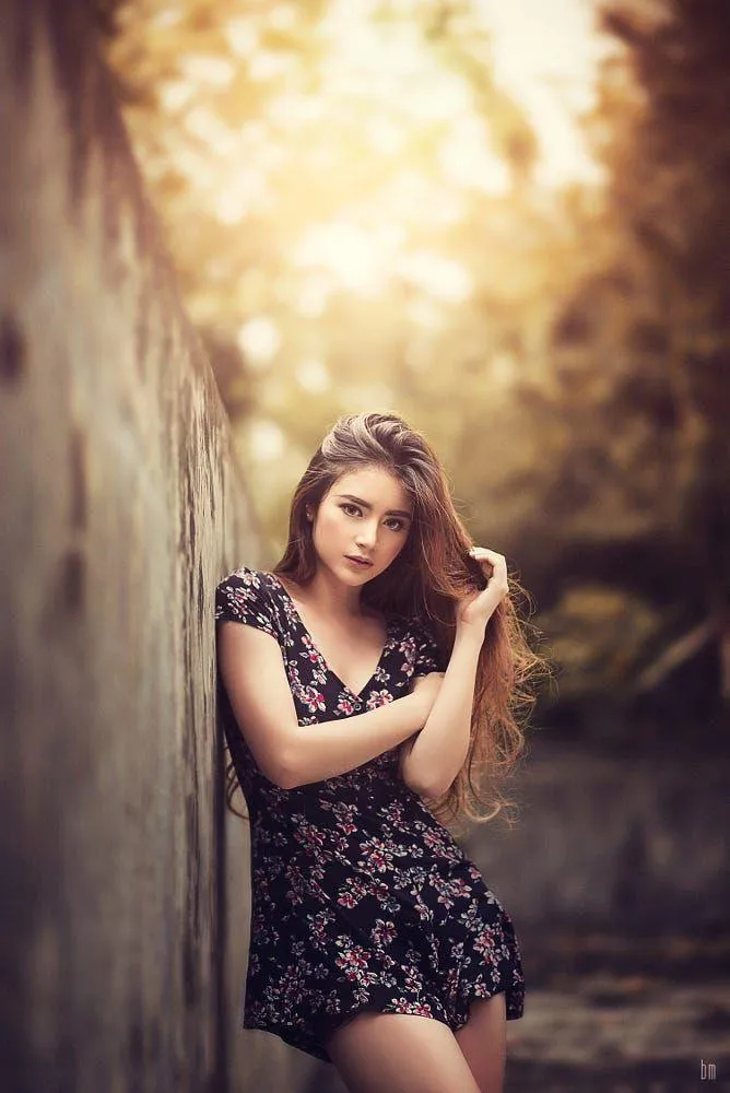 Girl in a Floral Dress Posing in Golden Hour Forest Light