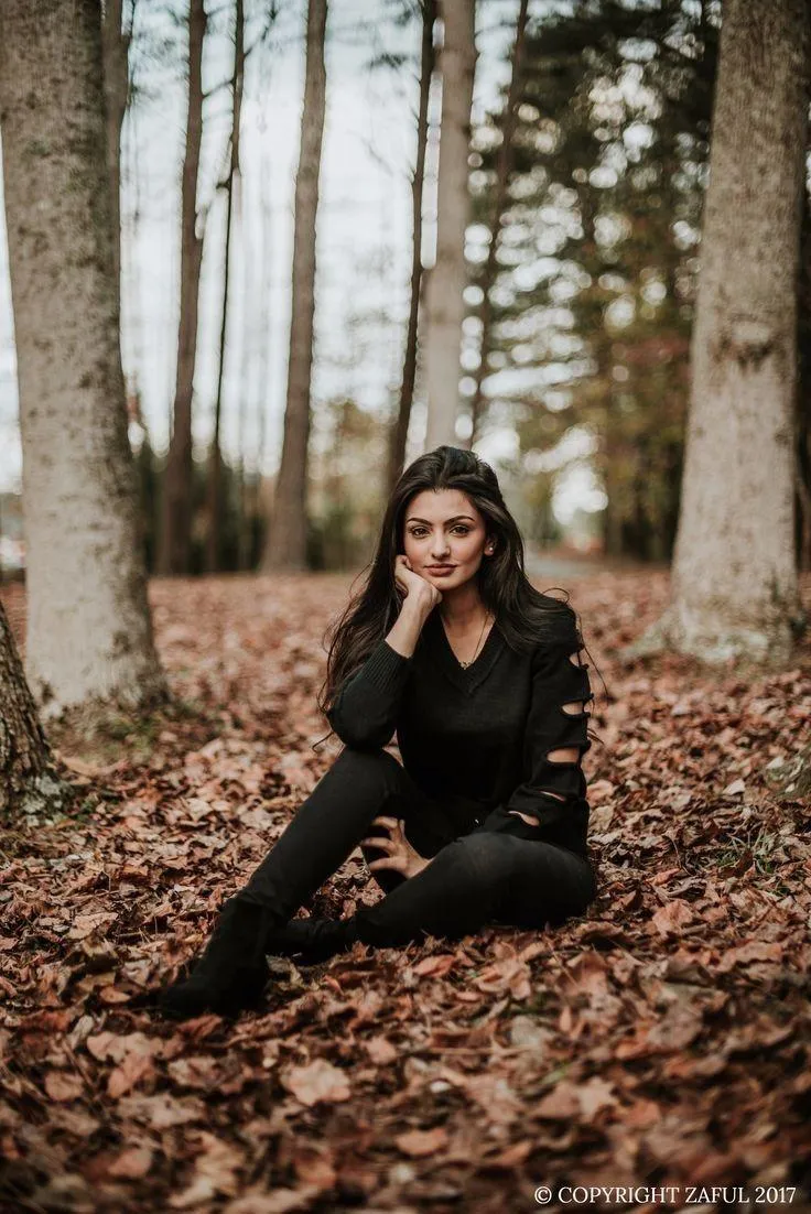 Girl Sitting Alone on the Dock Watching a Colorful Sunset
