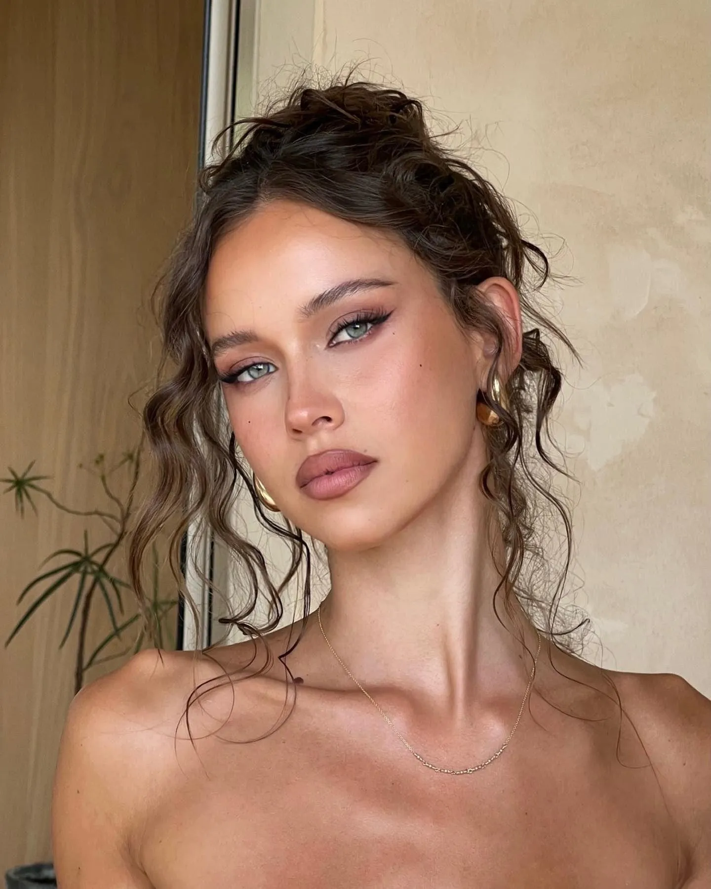 Glamorous Close Up of a Woman with Curly Hair Indoors Image
