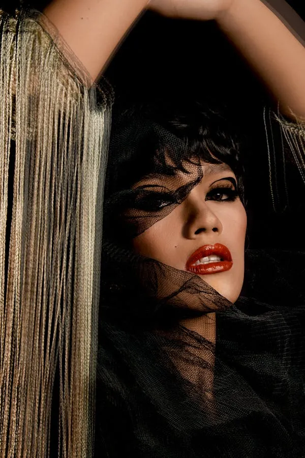 Glamorous Model Posing with Fringe Backdrop Free Wallpaper