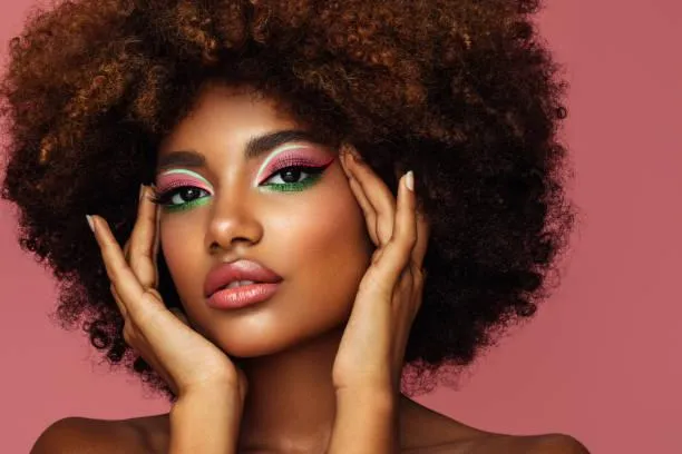 Glamorous Woman with Afro Hairstyle and Green Eyeshadow