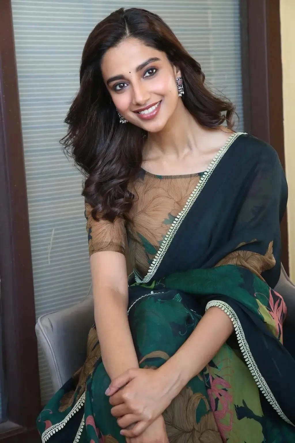 Gorgeous Meenakshi Chaudhary in Elegant Green Saree Picture