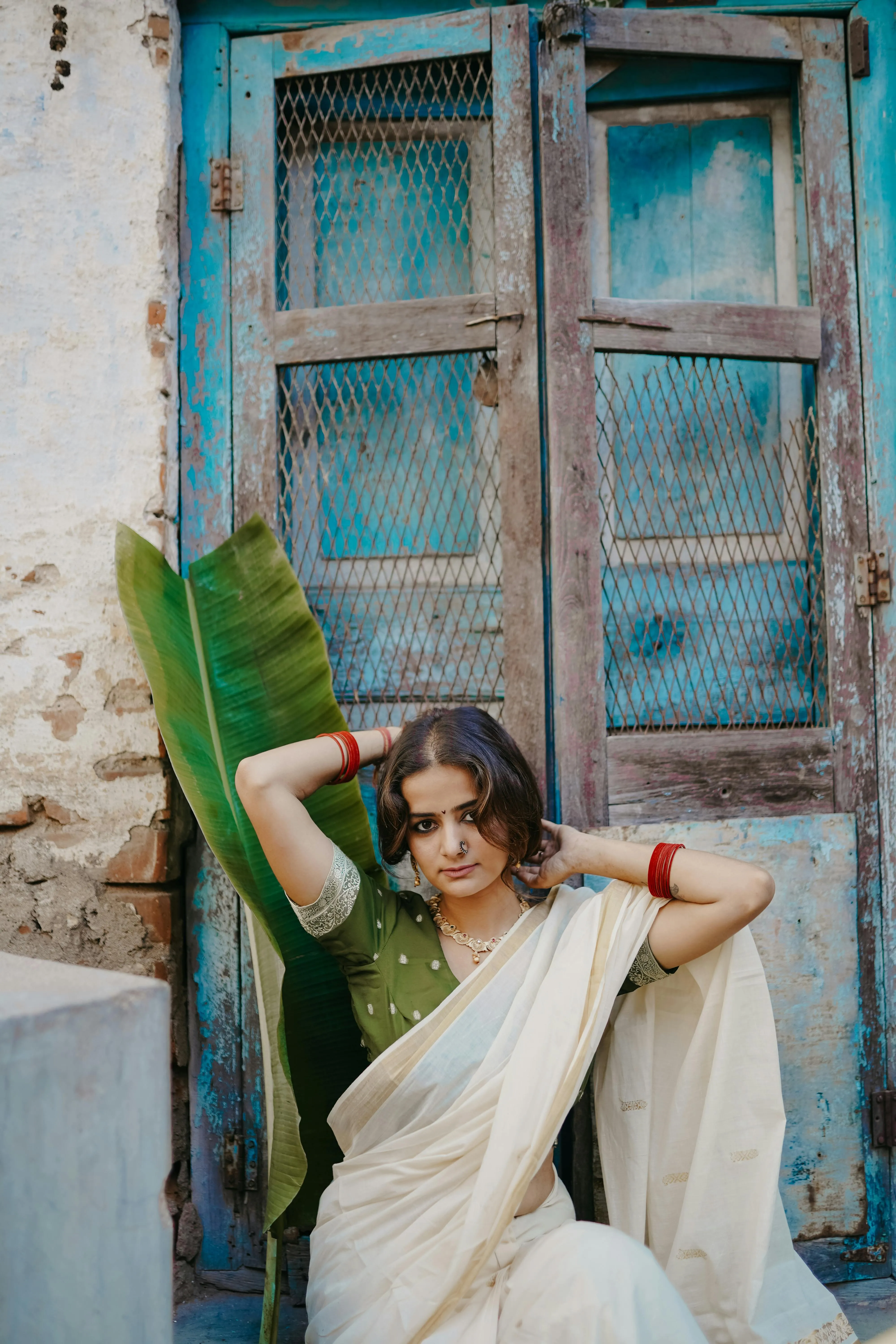 Gorgeous Young Woman in White Saree Near Wooden Door Picture