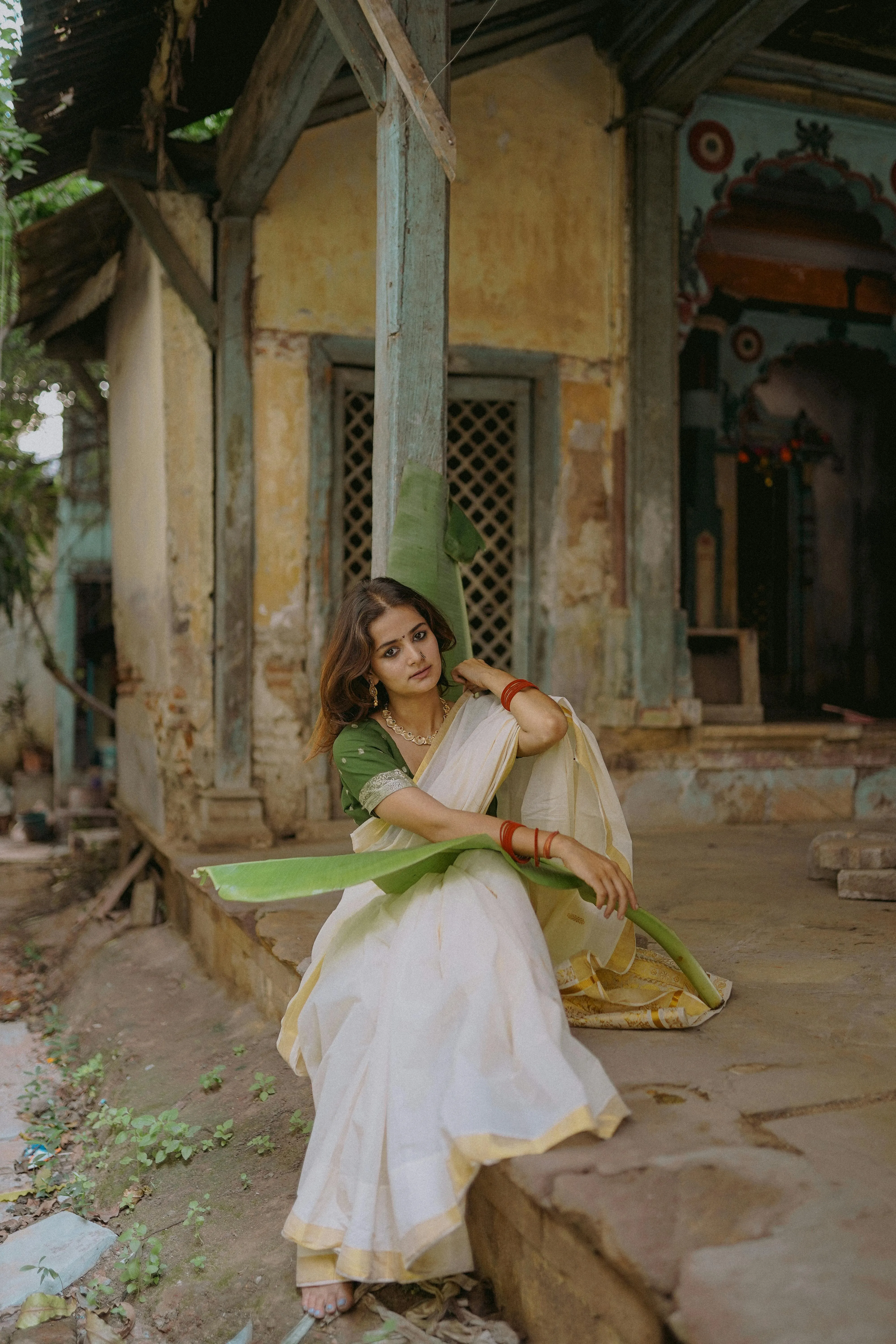 Gorgeous Young Woman in White Saree Sitting Corridor Picture