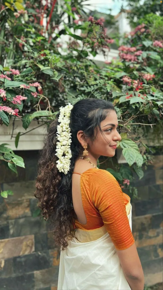 Hansika Krishna in a white saree with an orange blouse image