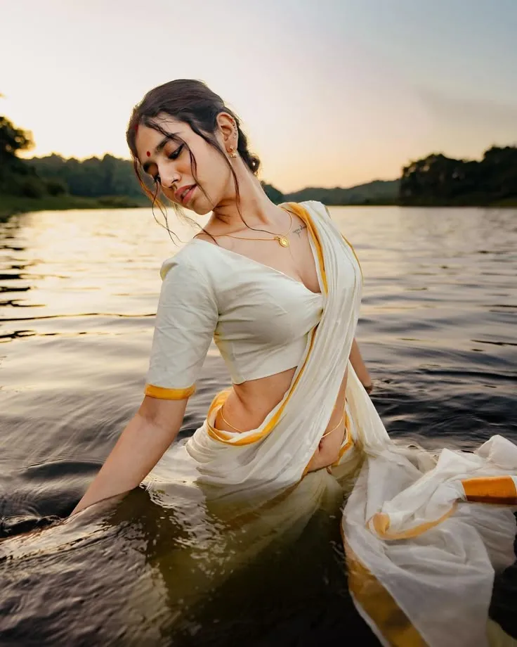 Hot image of Priya Prakash Varrier standing in the water