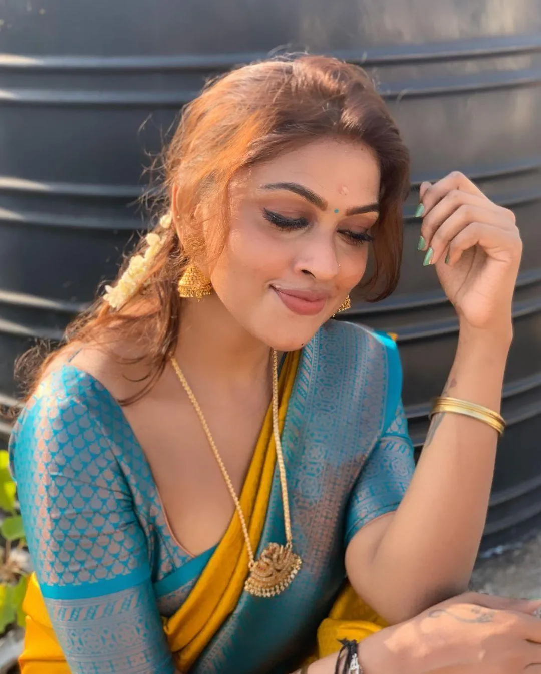 Hot Sri Nikha in Blue Saree with Graceful Pose Wallpaper