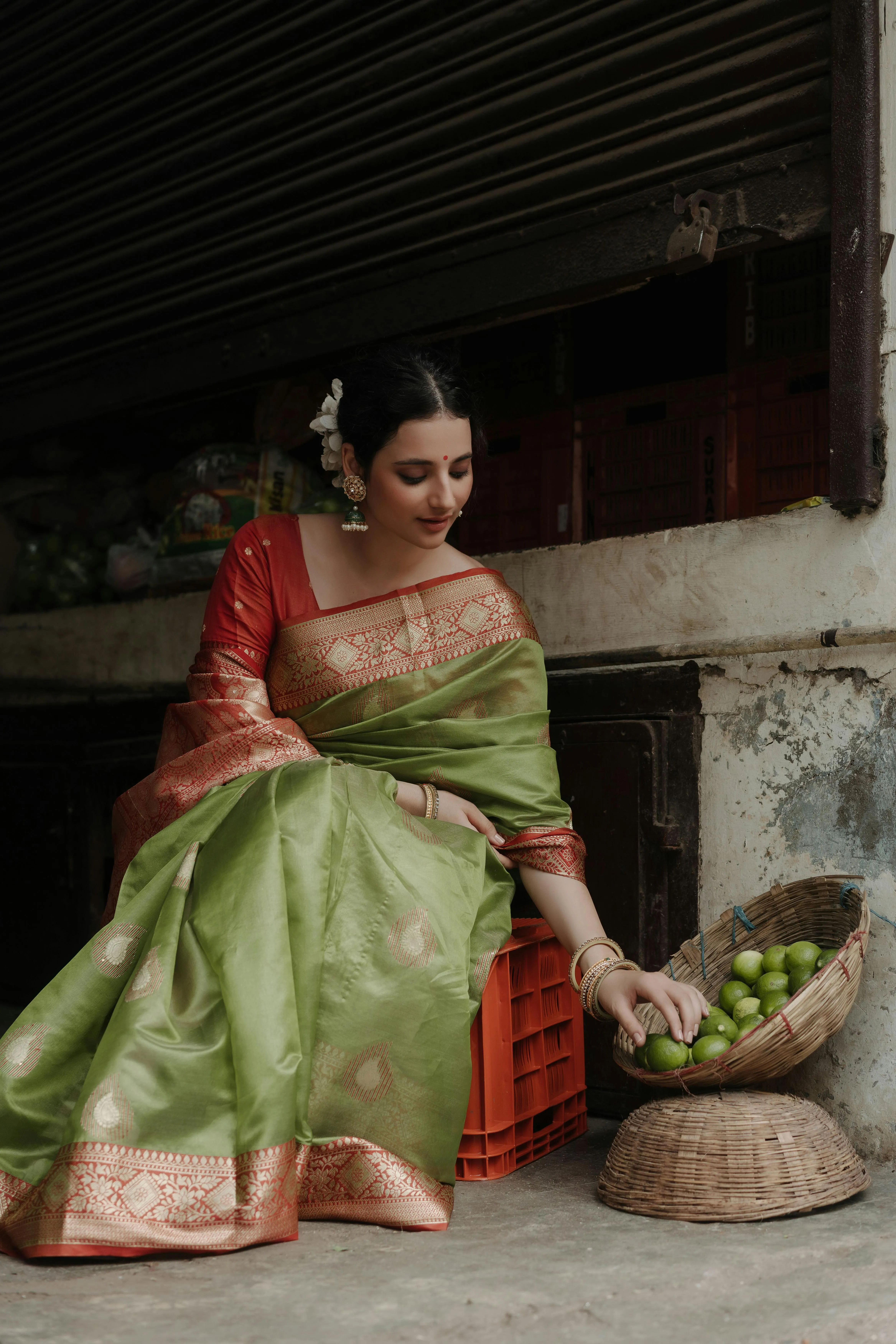 Hot Young Woman in Green Saree Sitting Relaxed Pose Picture