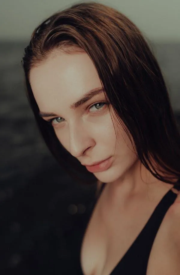 Intense Close Up of a Woman with Wet Hair and Soft Focus