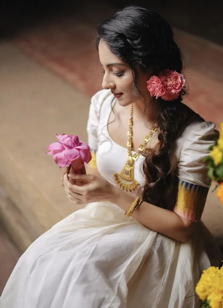 Ishaani Krishna in a Kerala dress looking pink flower image