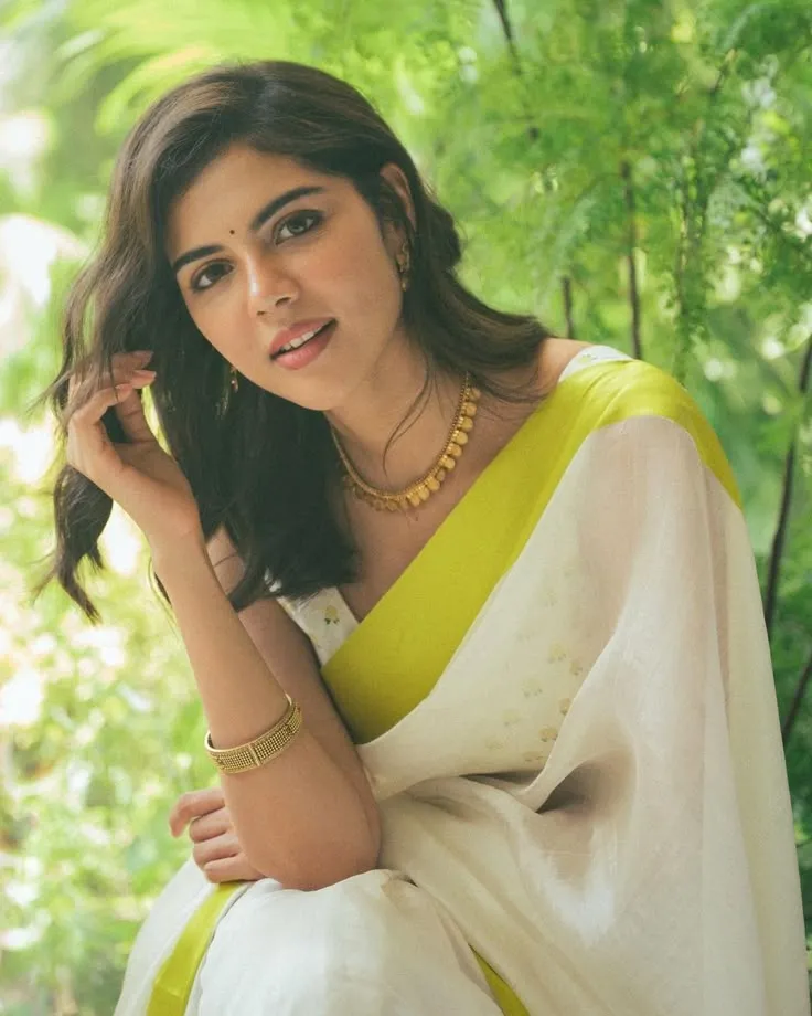 Kalyani Priyadarshan in a white saree with neon green border