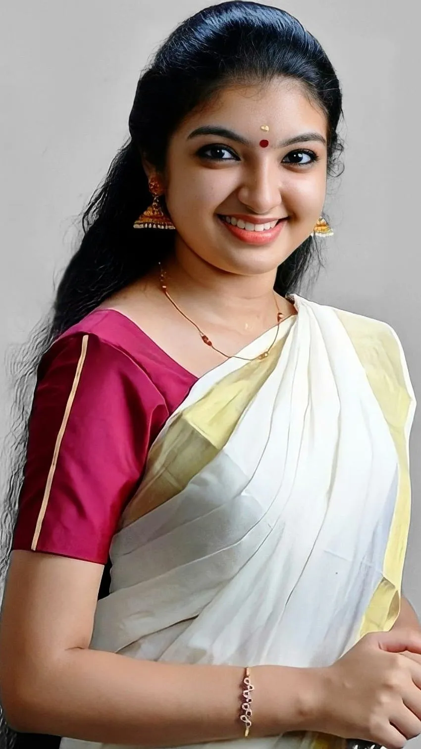 Malavika Nair in a traditional Kerala saree with a smile