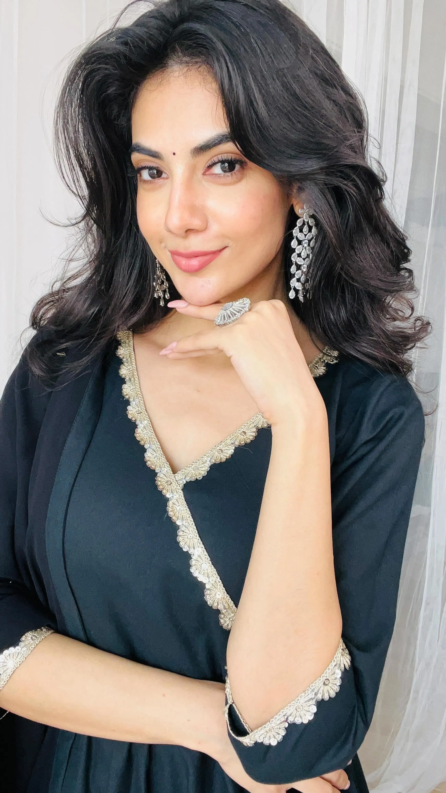 Malina in Black Saree Posing with Confidence and Grace Image