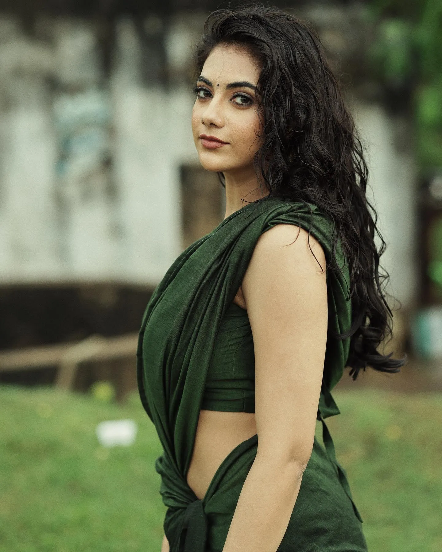 Malina in Green Saree Posing Outdoors Gracefully Calm Image