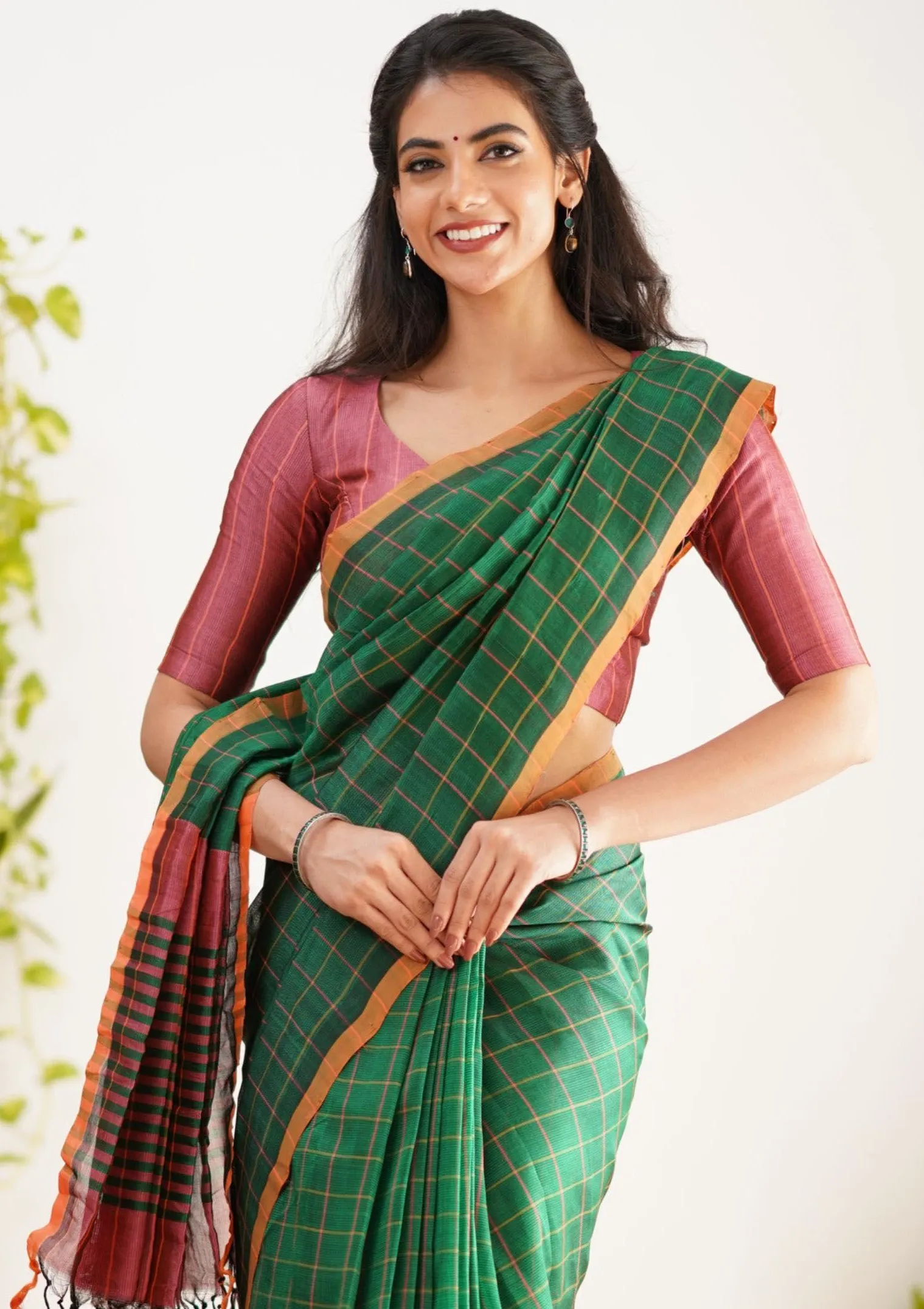 Malina in Green Saree Standing Outdoors with Elegance Image