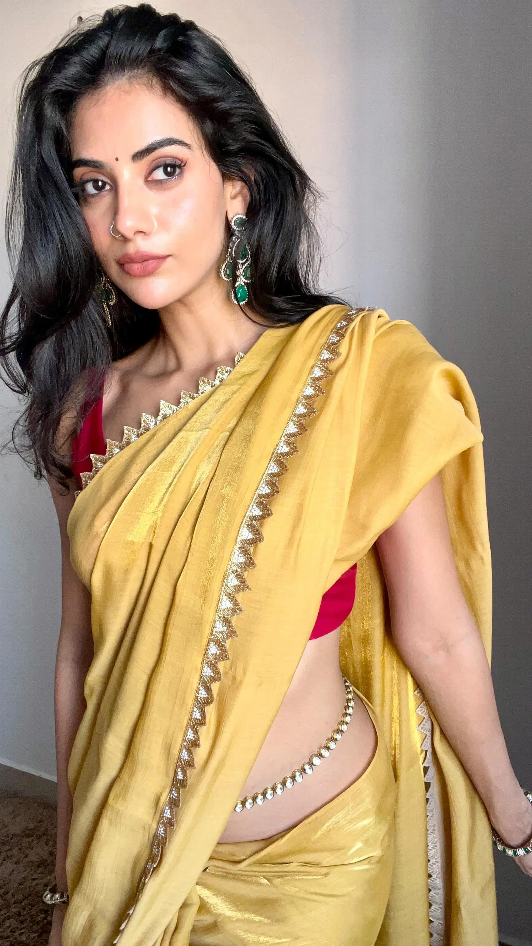 Malina in Yellow Saree Smiling with Charm and Elegance Image