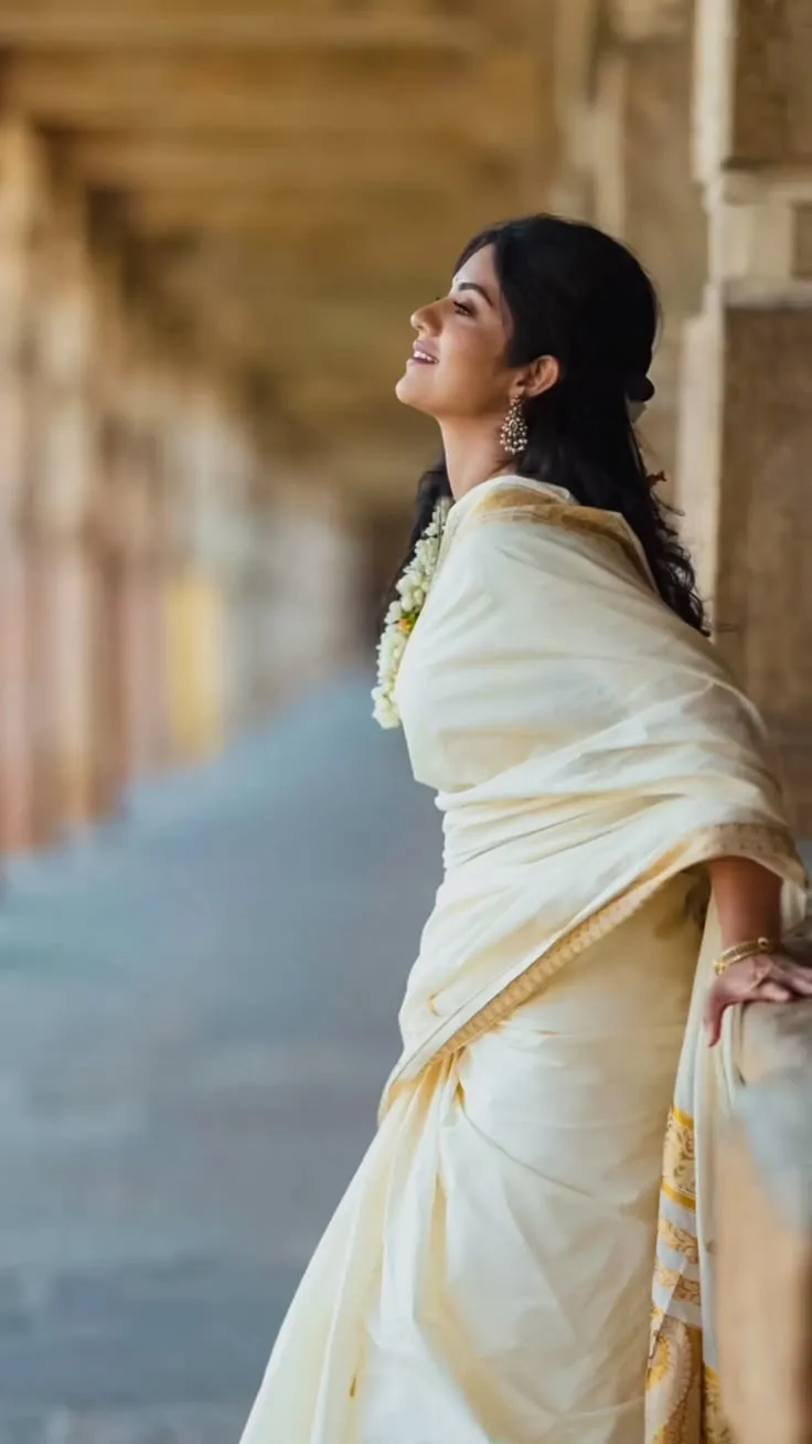 Megha Shetty in a Nerial saree dress near a historical place
