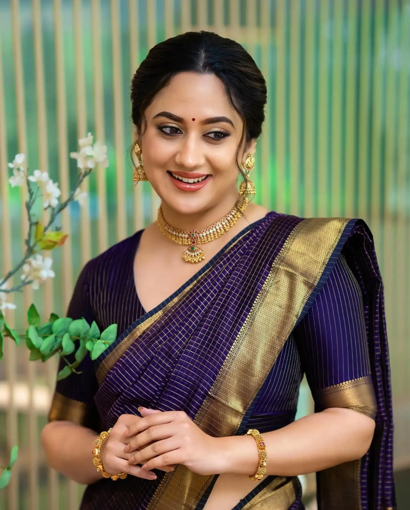 Miya George in Black Saree Smiling with Natural Charm Image