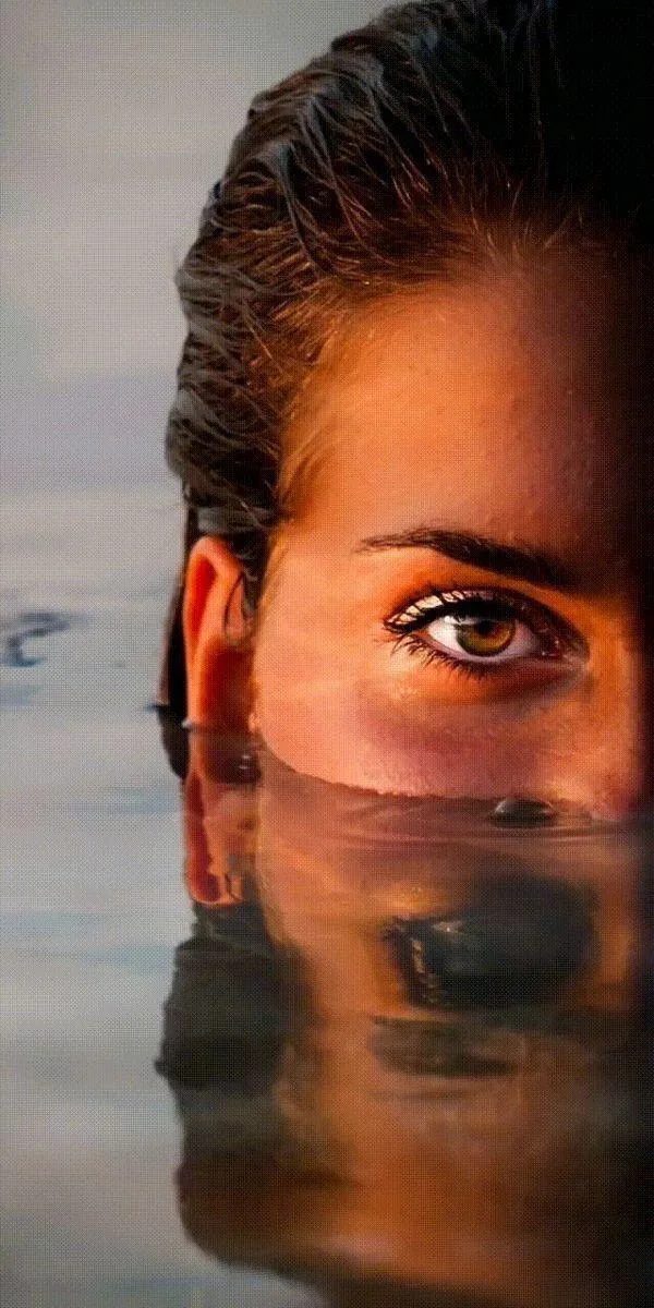 Mysterious Woman Model Half Submerged in Reflective Water