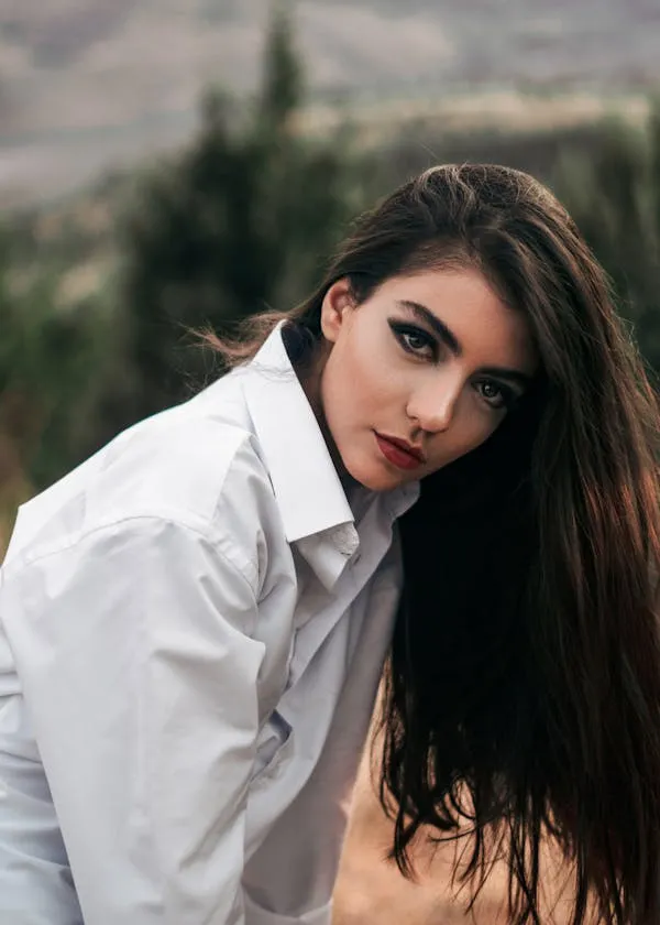 Natural Beauty with Long Hair Wearing a Classic White Shirt