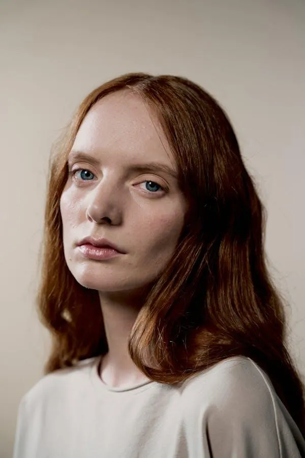 Natural Portrait of a Woman with Red Hair in Soft Light