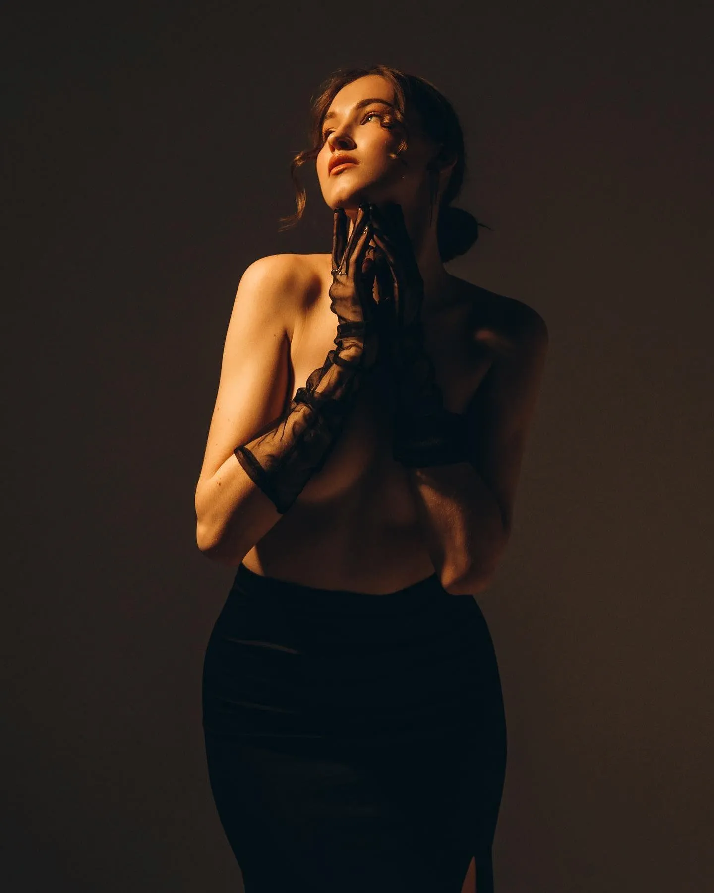 Nude Toned Artistic Portrait of a Woman in Dramatic Lighting