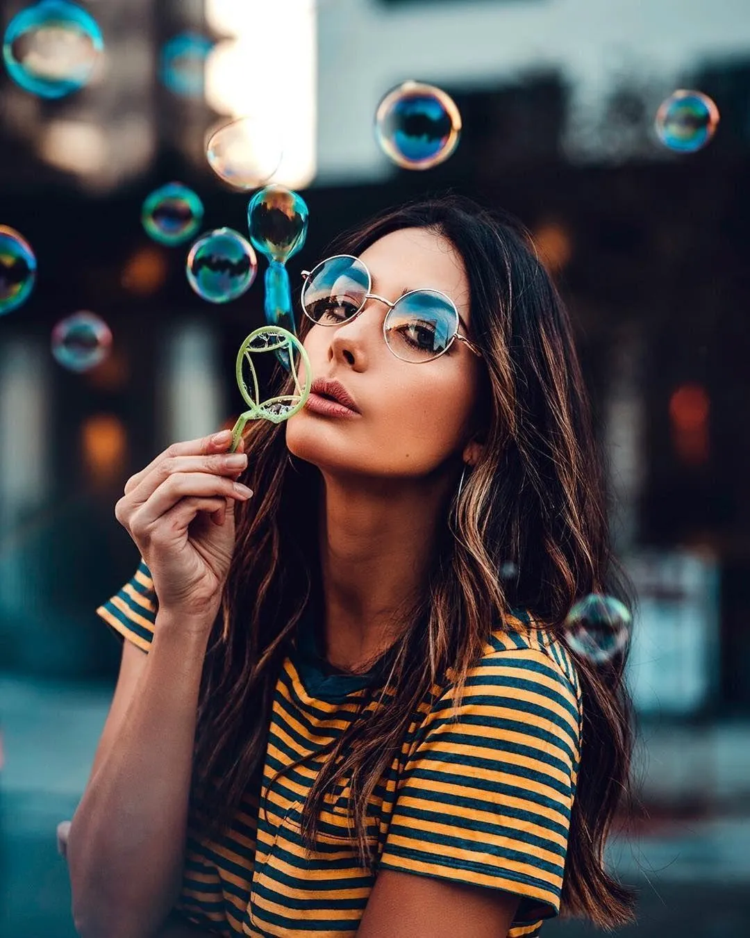 Playful Girl Blowing Bubbles in a Bright Colorful Portrait