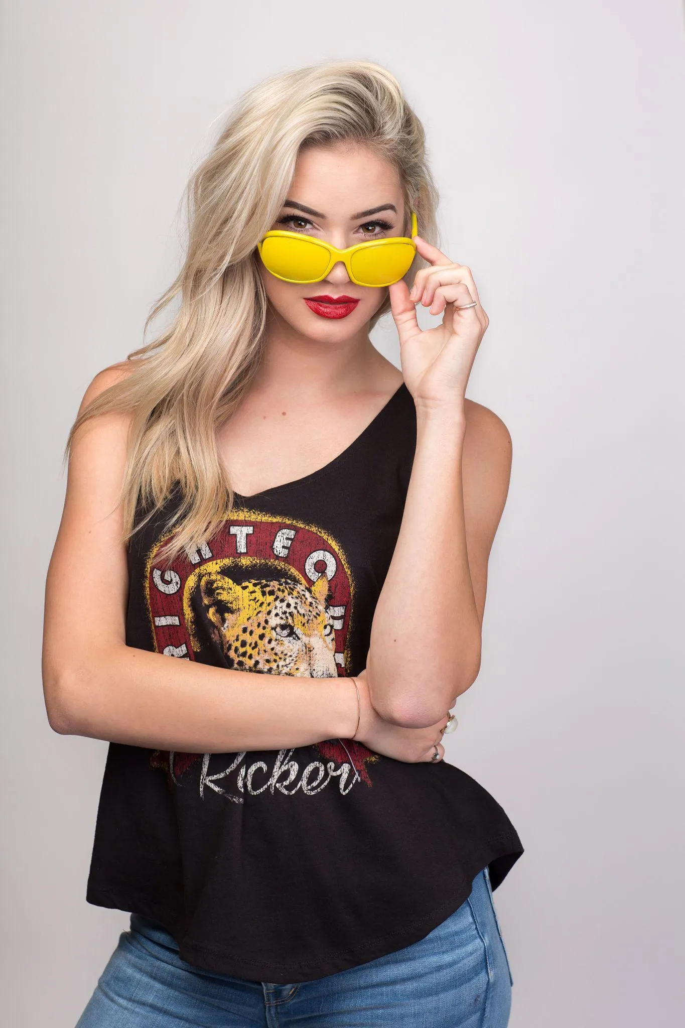 Playful Girl with Sunglasses and Bright Modern Fashion Vibe