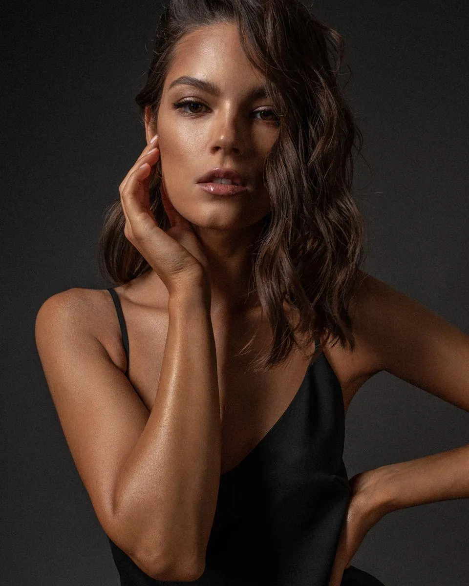 Portrait of a Confident Woman in a Black Top Free Wallpaper