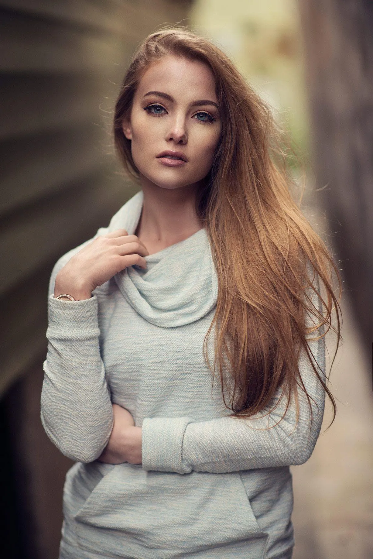 Portrait of Woman in Light Sweater with a Serious Expression