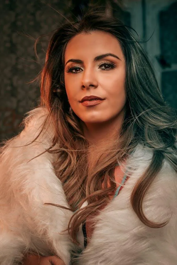 Portrait of a Woman with Long Hair and Warm Light Wallpaper