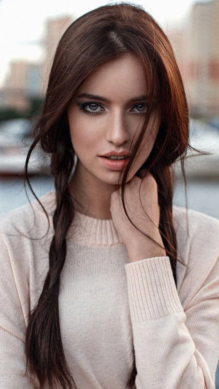 Portrait of a Woman in a Pink Sweater with Soft Natural Glow