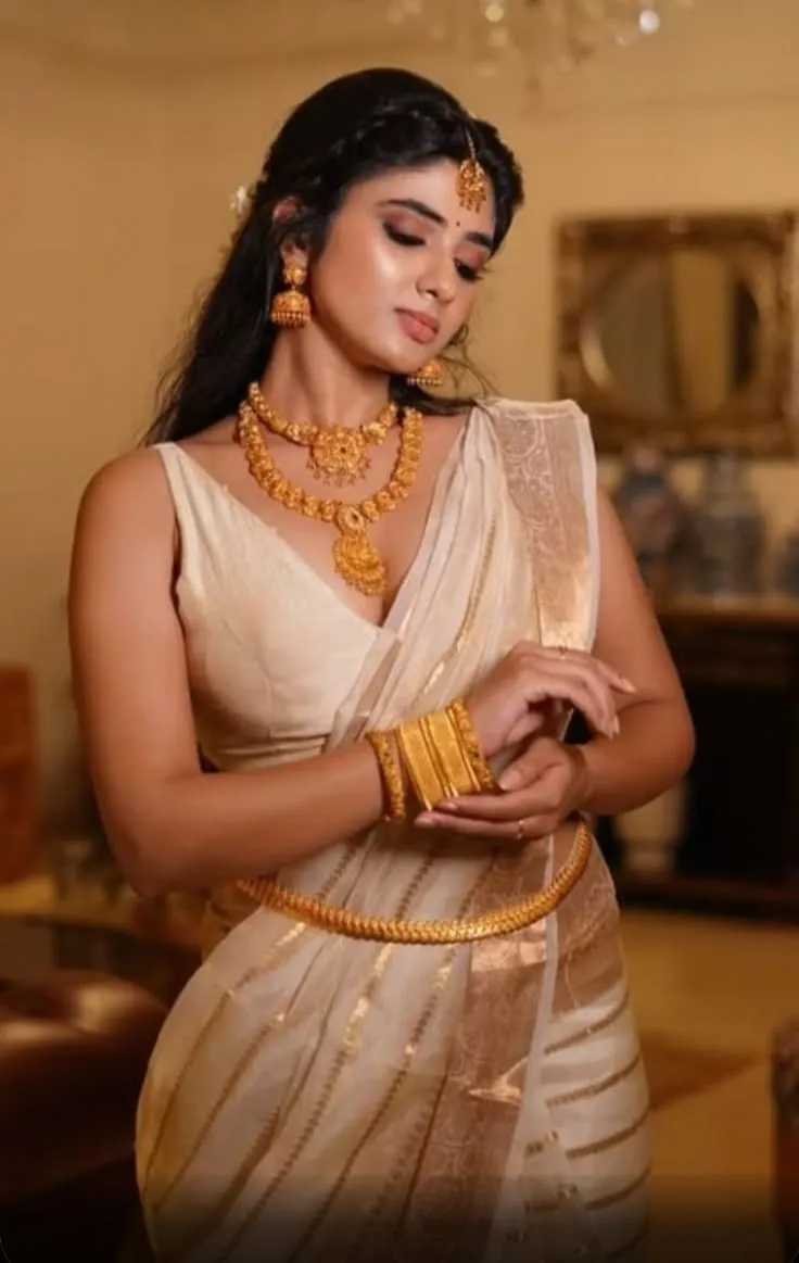 Pragya Nagra in a golden dress and gold jewels HD wallpaper