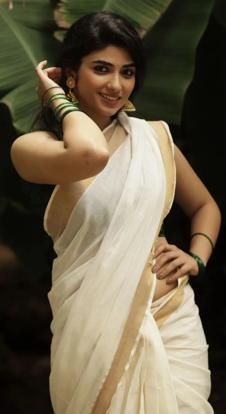 Pragya Nagra standing near the banana tree wearing a saree