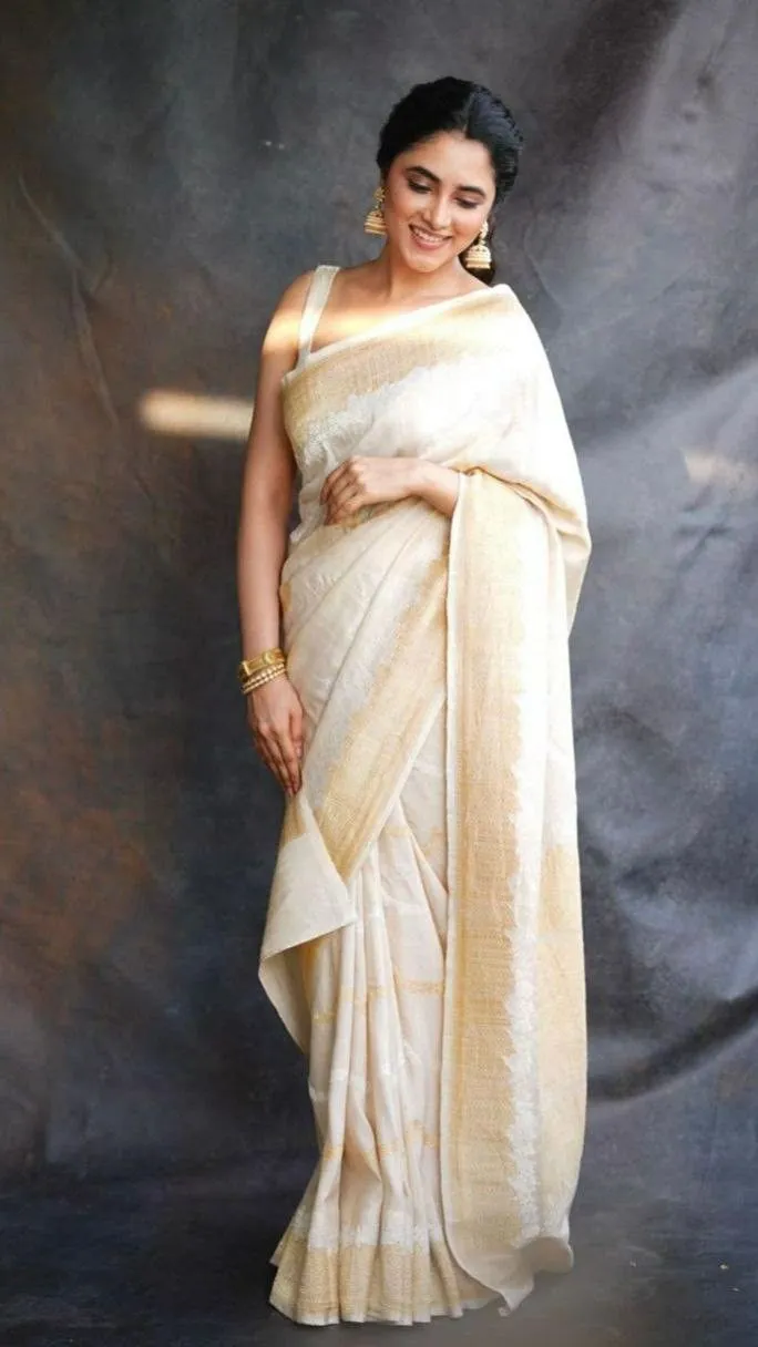 Priyanka Mohan in a Kerala saree standing near the black wall